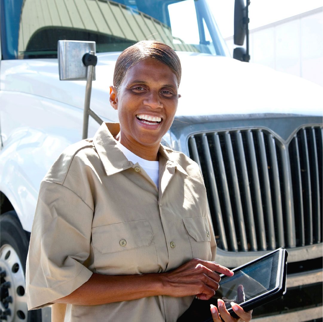 female-truck-driver-white-trucks-standing-2_adj_1080x1080