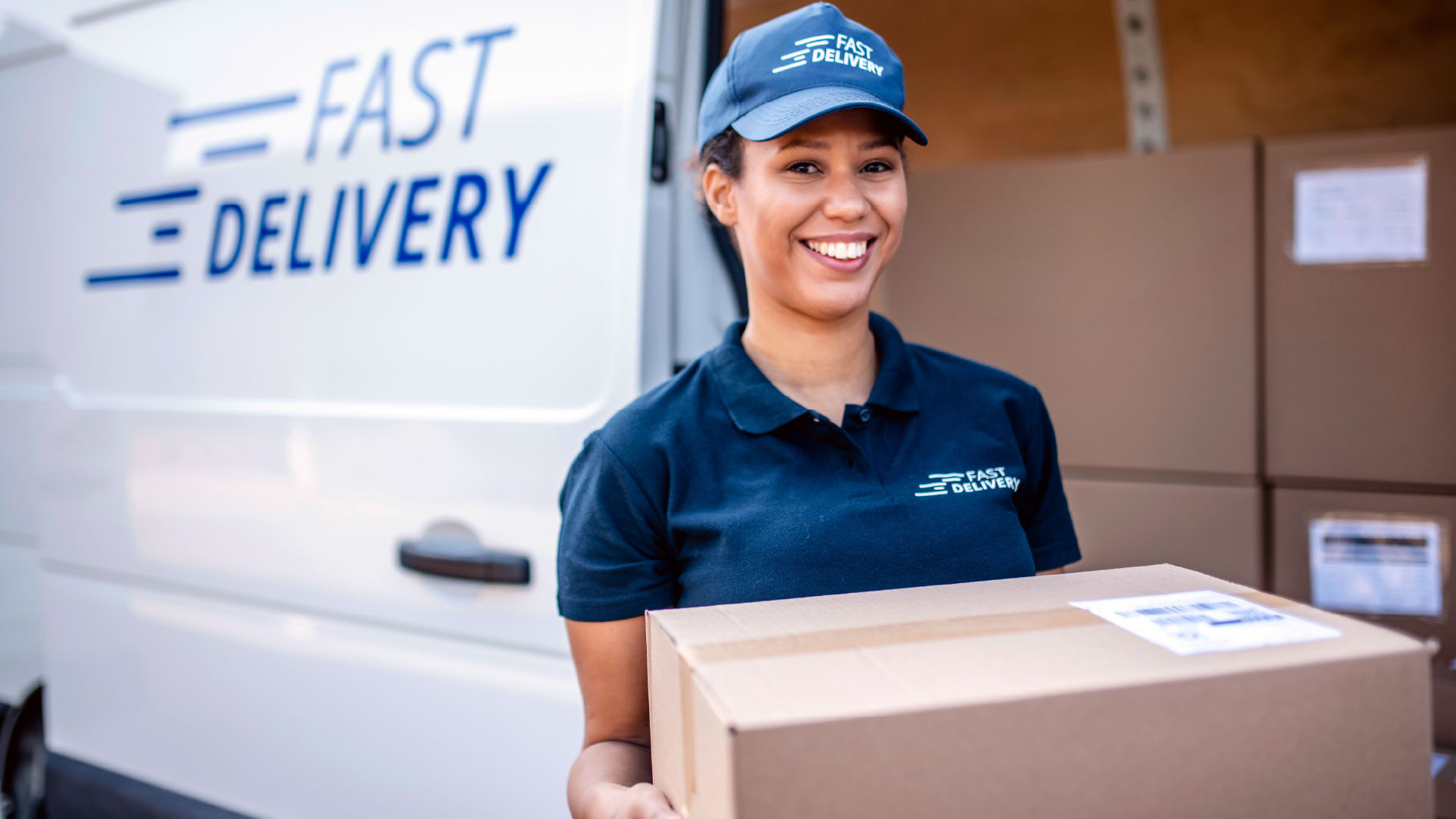 female-delivery-driver-white-van-3_adj_1920x1080