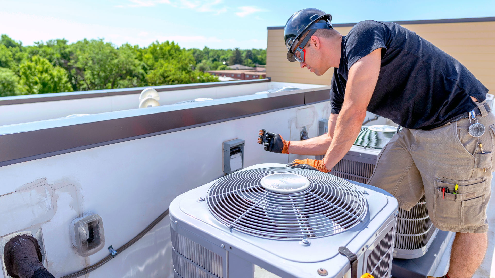 hvac-technician-repairing_adj_1920x1080