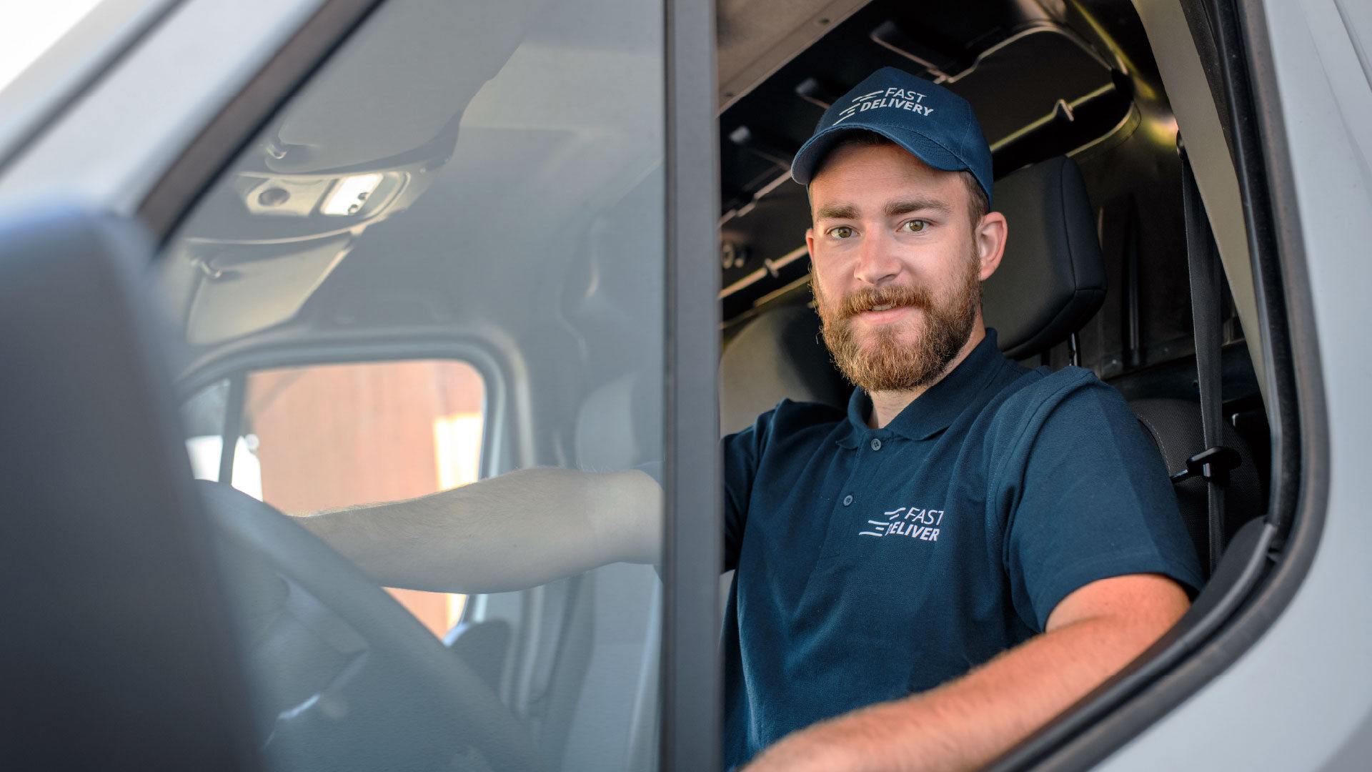 male-delivery-driver-driving-3_adj_1920x1080