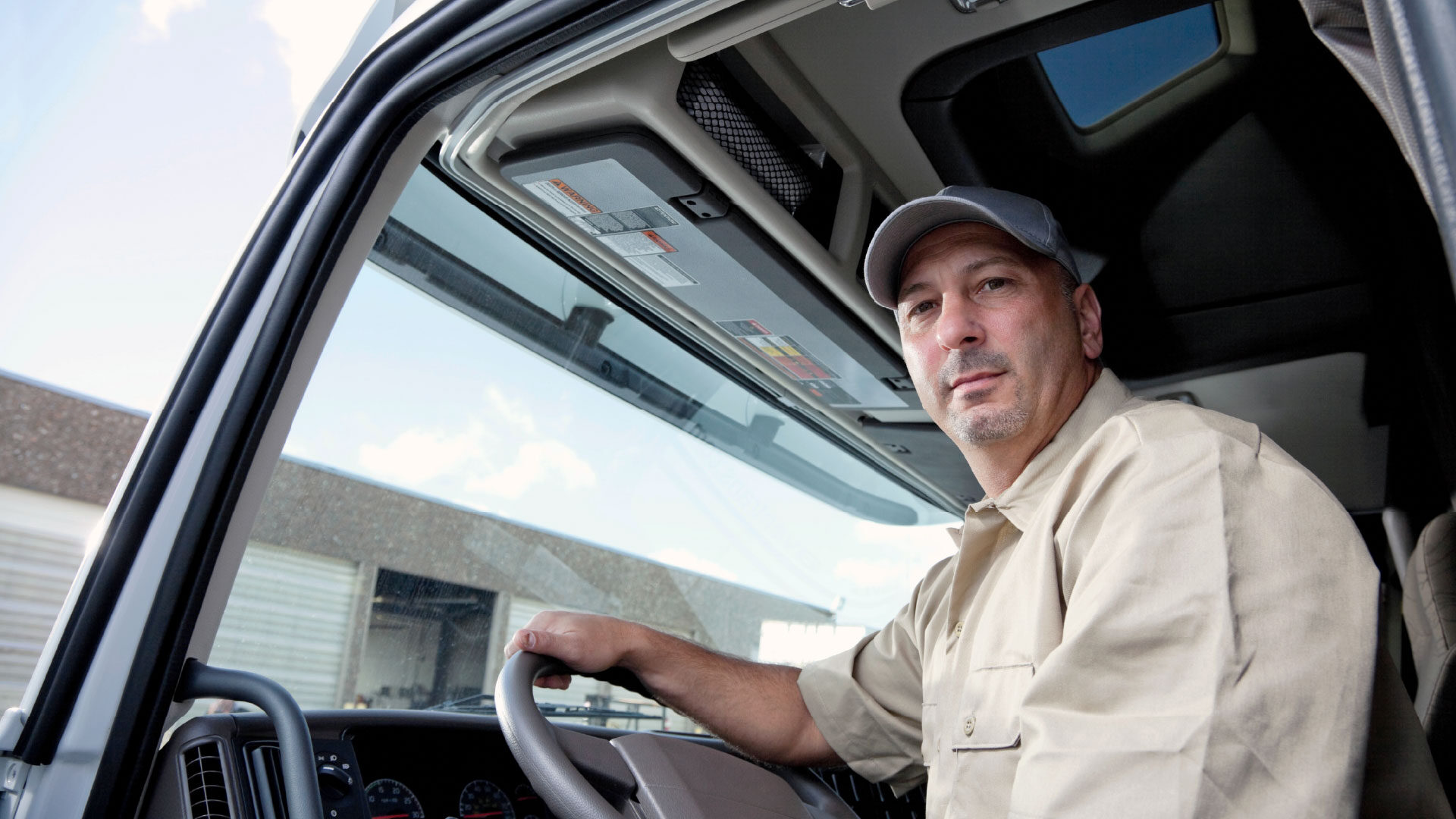 male-truck-driver-white-truck-driver-seat-4_adj_1920x1080