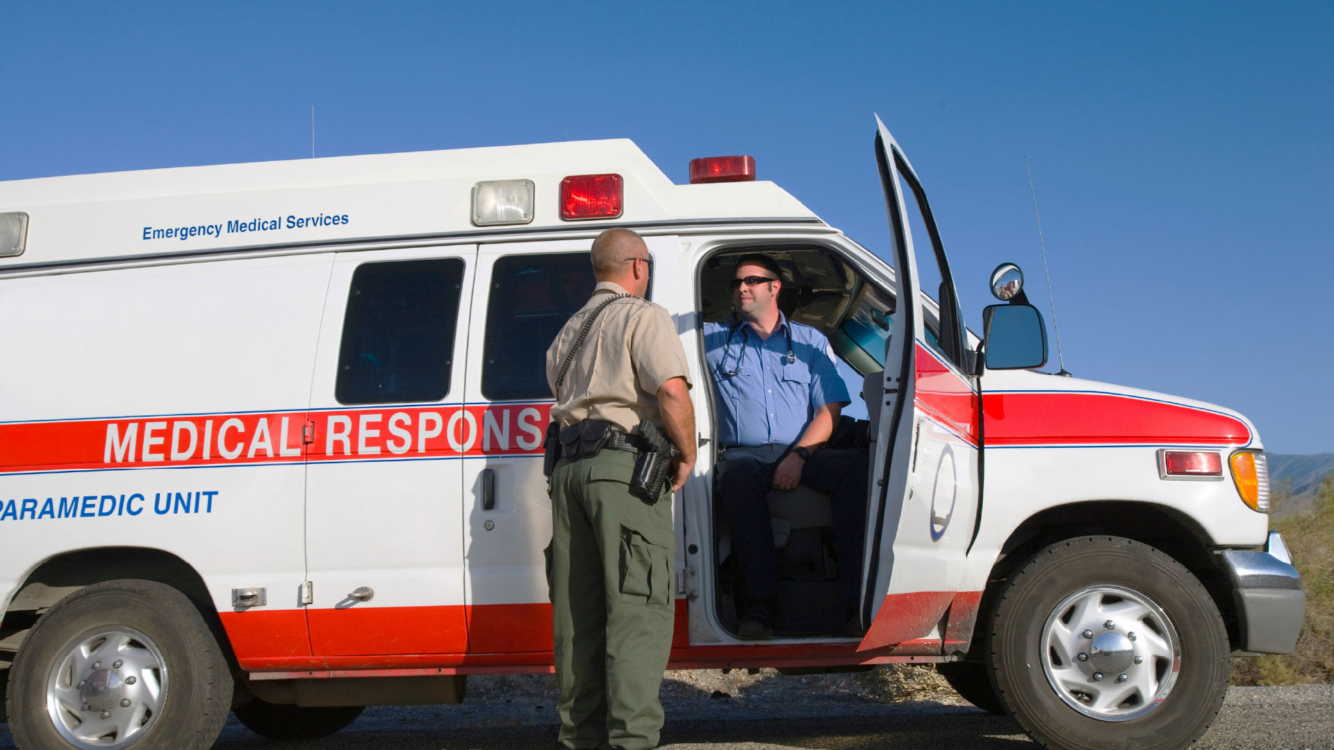 paramedic-sitting-ambulance_adj_1920x1080