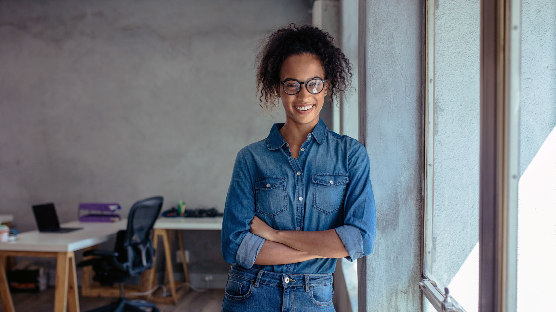 small-business-owner-standing-office_adj_1920x1080