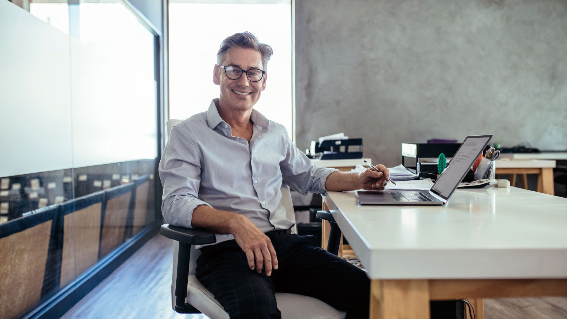small-business-owner-working-desk-2_adj_1920x1080