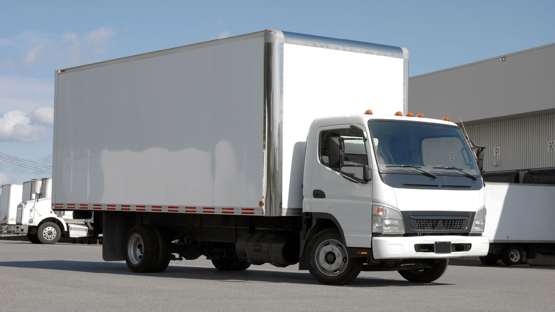 white-delivery-truck-distribution-warehouse_adj_1920x1080