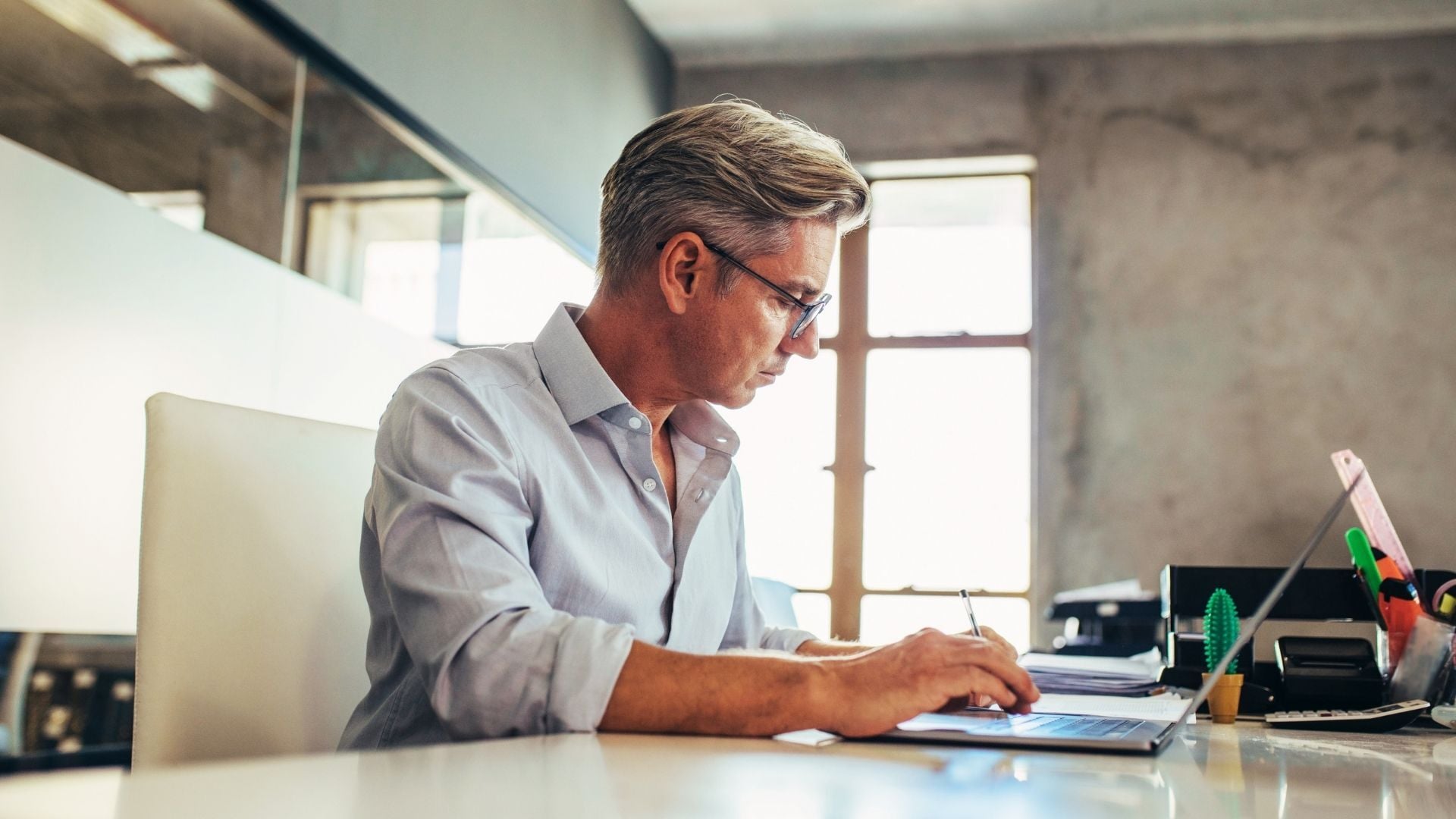 small-business-owner-working-desk-4_adj_1920x1080